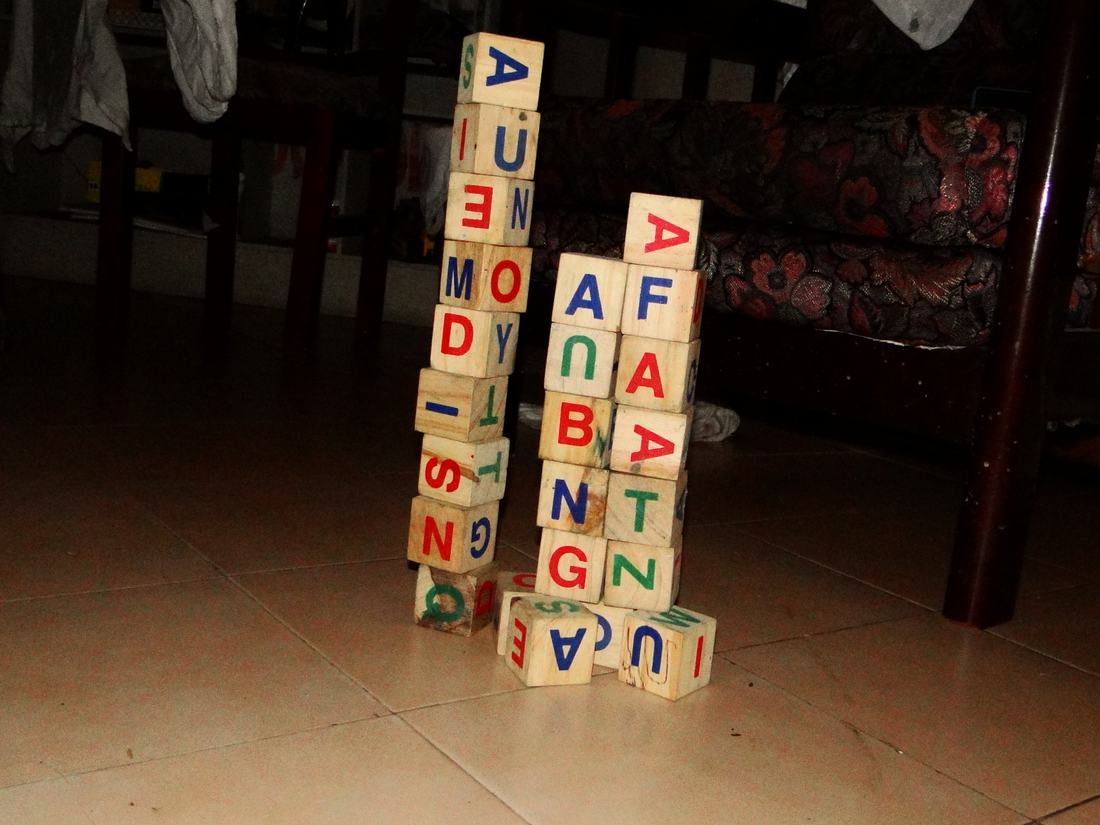 A pile of alphabet wooden blocks