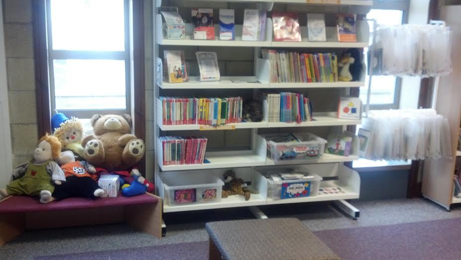 Children's books on library shelves